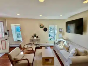 Bright living room with hardwood floors and modern furnishings in Cape May vacation rental