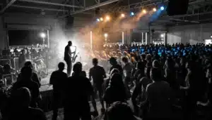 Crowd at Cape May Jazz Festival 2026 schedule event inside Convention Hall with stage lights and haze