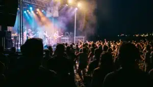 Crowd energy at a Cape May vacation beach concert with stage lights and haze