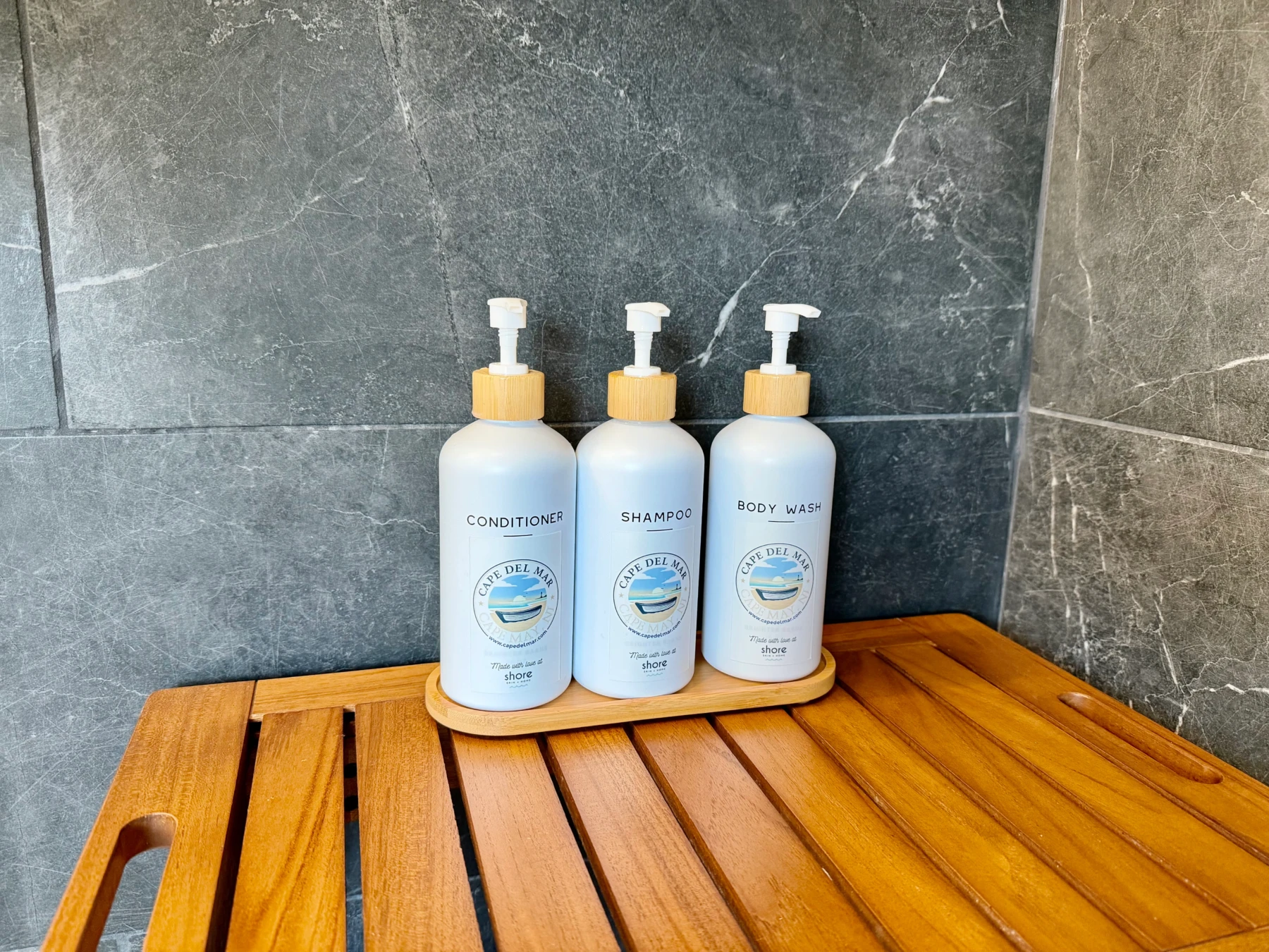 Luxury bathroom amenities with white bottles in Cape May La Mer bathroom