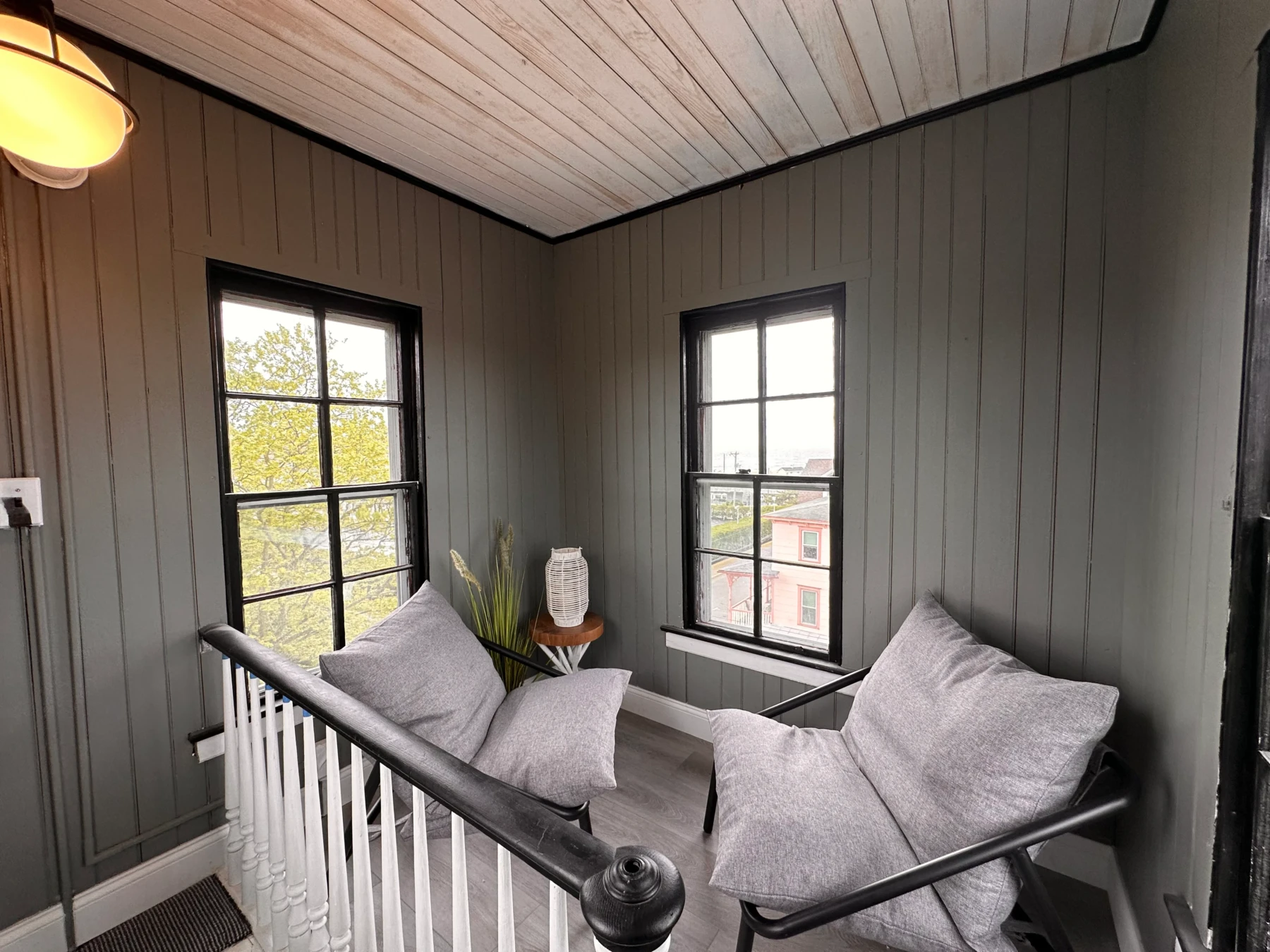 Modern loft bedroom with daybed and windows in Cape May bed and breakfast