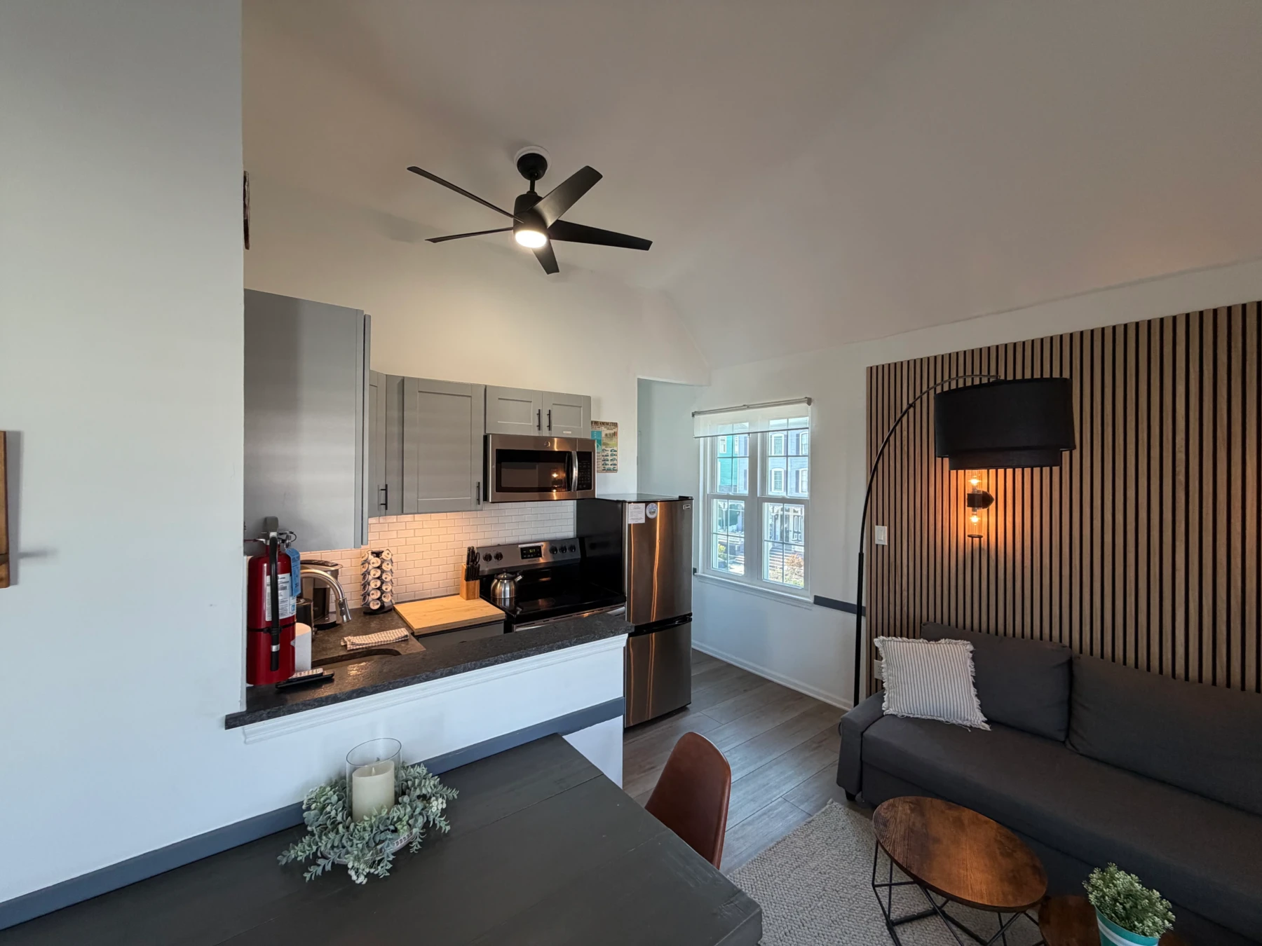 Modern kitchen with stainless steel appliances and white subway tile at Cape Surf in Cape May