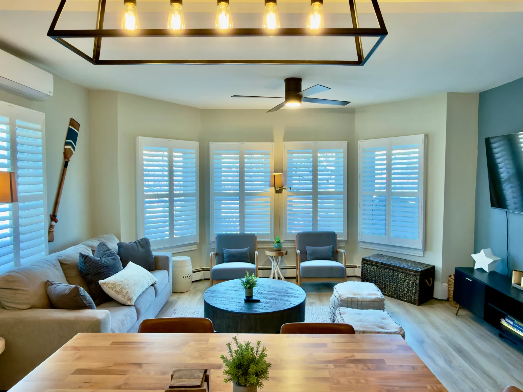 Bright living room with ocean views and walkable coastal style decor at Cape Oar